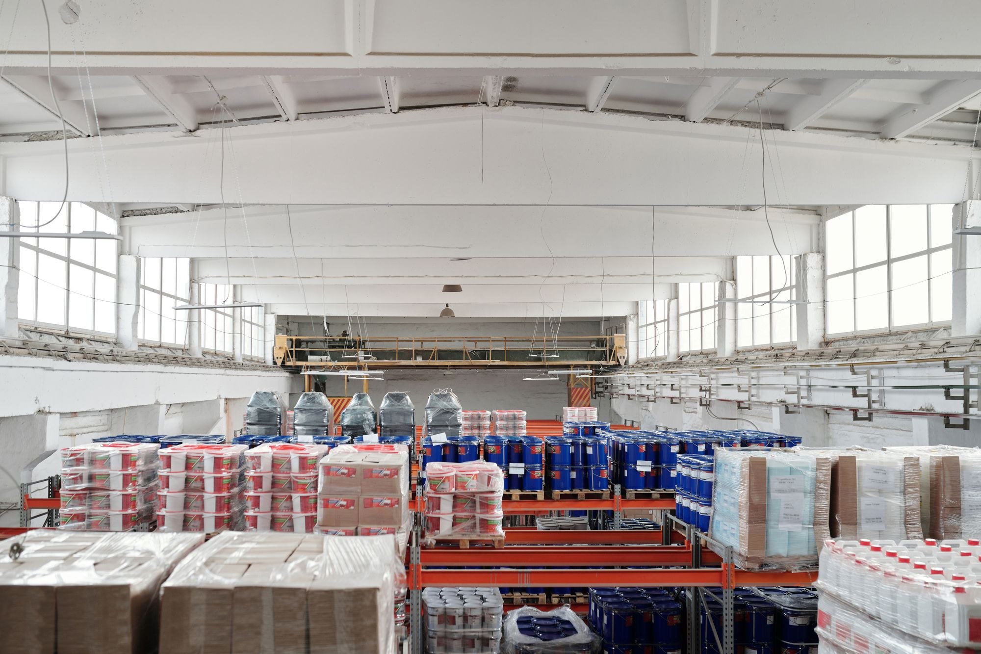 Palletized goods arranged on warehouse storage racks